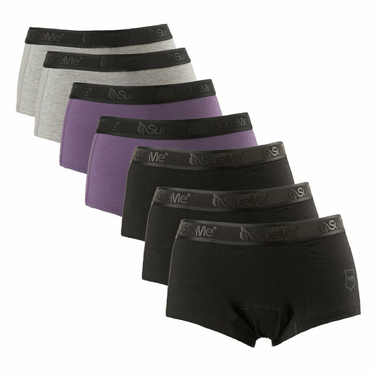 A mixed 7 pack of black, purple and blue women's sustainable beech shorties sports underwear displayed in two rows with the brand name 'SueMe' on the waistband.